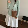 Bolso para teléfono móvil con patrón tejido de diseño de nicho versátil para mujer, nuevo modelo 2026, bolso de hombro y bandolera portátil simple y elegante