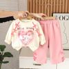 Niñas 2025 Lindo Amor Dibujos Animados Hombro Lazo Primavera y Otoño Manga Larga Pantalones Holgados Ropa de Niña Conjunto de Dos Piezas