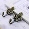 Gancho de pared de aleación de zinc moderno y simple con forma de flor grande gancho de pared gancho de pared accesorios para cortinas al por mayor gancho de cortina perforado suministro transfronterizo