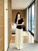 Hermoso conjunto deportivo casual estilo coreano para mujer, conjunto de dos piezas de verano reductor de edad y adelgazante con top de manga corta de seda helada y pantalones tipo falda de pierna ancha