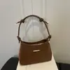 Bolsas de Alto Valor Estético para Mujer Primavera 2026 Nuevo Bolso de Hombro para Viaje Diario Moda Simple Diseño de Nicho Bolso Tote Pequeño de Hombro Único