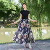 26 Nova Saia Estampada Estilo Boho Resort Europeu e Americano Primavera/Verão com Barra Larga para Mulheres