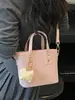 Bolso bandolera de un solo hombro casual elegante de nicho Shuai Mi Jia, moderno bolso cubo para mujer nuevo de verano 2026