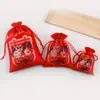 Bolsa de dulces de boda de fábrica bolsa de la suerte de Año Nuevo bolsa de la suerte con borde rojo bolsa pequeña de tela roja bolsillo con cordón