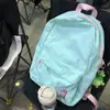 Mochila simple y fresca de color liso 2023 nueva mochila ligera para estudiantes bolso de mano casual de moda versátil para mujer