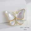 Broche Camelia Flor de Perla animal Alto sentido mariposa broche corsage joyería al por mayor Accesorios para abrigos de mujer