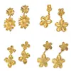 Aretes de flor dorada para mujer, aretes versátiles de moda de lujo ligero, diseño de nicho con un toque de alta gama, comercio exterior transfronterizo