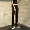 Jeans de mujer estilo coreano de cintura alta, elásticos, ajustados y adelgazantes, con abertura frontal y un ligero bootcut, de largo completo, para Primavera/Verano 2026