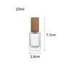 Al por mayor en stock Múltiples especificaciones y estilos Botella dispensadora de perfume simple y portátil Botella rociadora Botella dispensadora cosmética Tapa de madera