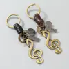 Llavero de Cuero Tejido Hecho a Mano para Coche de Hombre Estilo Retro Artístico con Accesorio de Colgante de Nota Musical de Aleación Antigua Bronce Creativo