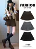 Falda midi de tweed de lana color café para mujer 2026 nueva otoño e invierno de cintura alta ajustada línea A para chicas petite falda corta plisada