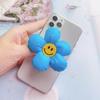 Soporte para teléfono móvil con diseño de cara sonriente de tela creativa, soporte para tableta de escritorio, soporte para airbag con diseño de flor de girasol estéreo, venta al por mayor