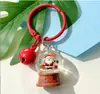 Chaveiro novo transfronteiriço criativo único pingente de bola de cristal de Natal estilo trenó renas patins de gelo decoração interna