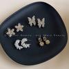 Pendientes elegantes de mariposa de cristal de estilo francés, diseño de nicho para mujer, pendientes ligeros de lujo, pendientes de flores de temperamento dulce de alta calidad.