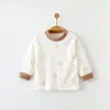 Blusas de bebê para primavera e outono, camiseta infantil de manga comprida de algodão puro Classe A com botões nos ombros, nova blusa básica para bebê