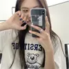 2026 Novo Estilo Coreano Chique Estampa de Urso Solta Versátil de Verão Manga Curta Comprimento Médio Camiseta Top Feminino Tendência Ins