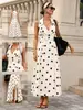 Nuevo vestido largo elegante de línea A sin mangas con cuello en V y cinturón, estilo gabardina, con lunares, transfronterizo europeo y americano, para mujer