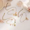 Pulsera Taina de Acero Inoxidable Europea y Americana Simple y de Alta Gama Estilo Playa Palmera Estrella de Mar Pulsera con Goteo de Aceite Lujo Accesible Nicho para Mujeres