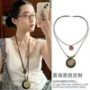 Collar de metal cruzado vintage desgastado estilo nacional Bohemio colgante de anillo largo cadena de suéter versátil moda