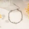 Pulseira de aço inoxidável banhada a ouro, com design de ondas d'água em camada dupla, moderna e luxuosa, com design que previne o desbotamento, perfeita como presente para melhores amigos ou casais.