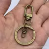 Juego de Tres Piezas de Hebilla de Puerta Negra Mate, Hebilla de Puerta Dorada Más Gancho Giratorio Dorado Claro en Forma de Ocho con Anillo Plano Accesorios de Llave Transfronterizos