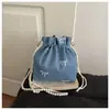 Bolsa de hombro cruzada casual dulce de mezclilla y lona estilo coreano de gran capacidad con lazo transfronteriza nueva con perlas