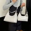 Versátil bolsa cruzada pequeña nueva con textura, bolso de hombro casual, bolso simple para debajo del brazo, moda para mujer verano 2026