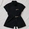 Camisa de verano INS transfronteriza negra con cuello alto y manga corta, botones metálicos, diseño único de ceñido a la cintura y abertura, top de estilo europeo y americano