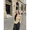 Top de punto ajustado de manga larga asimétrico para mujer, diseño de hombro descubierto, estilo chica picante, otoño e invierno