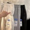 Fabricante original pantalones de gofre para hombre sueltos pierna ancha rectos deportivos casuales combinan con todo retro pantalones de punta hombre
