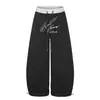 Moda 2026 nueva colección: Pantalones casuales de pierna ancha y pierna curva, de color liso, con estampado de letras, juveniles y a la moda, venta al por mayor desde una sola fuente, 55