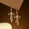 Pendientes colgantes de lazo sencillos y dulces de estilo coreano para mujer, ligeros, lujosos, de alta gama, con un estilo distintivo y combinables.
