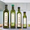 Botella de aceite de oliva verde oscuro marrón transparente al por mayor de fábrica, cuadrada, redonda, con tapa sellada para aceite de nuez y aceite de camelia.