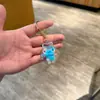 Chaveiro de acrílico transparente com areia movediça de desenho animado, pingente de bolsa, pequeno presente para crianças, decoração de carro