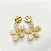 Pendientes florales exagerados de estilo europeo y americano para mujer, pendientes de botón dulces de nicho de lujo ligero, pendientes vintage simples para mujer al por mayor