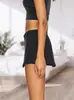 Mini Culotte Feminino de Cintura Baixa Ultra Curto com Shorts Embutidos Saia Preta Sexy Elástica Roupa Básica de Verão