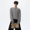Moda americana para otoño e invierno para hombre, camiseta de manga larga de forro polar con bloques de color personalizados, estilo retro y casual, con detalles de dobladillo sin rematar