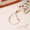 Lanyard para teléfono de cuenta de concha de 6*9mm, correa de muñeca, simple y elegante, accesorio Pixiu versátil, cadena para teléfono, mismo estilo que en Little Red Book
