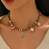 Collar trenzado multicapa navideño transfronterizo, una cadena de clavícula de Papá Noel única y creativa, un conjunto de joyería nuevo y elegante