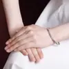 Pulsera Brillante Ovalada con Apertura de Flor Xiangyun de Plata 9999 Moda Simple Estilo Chino Pulsera Ajustable