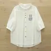 Camisa de manga corta con solapa de bolsillo bordada de conejo de dibujos animados, nuevo estilo de verano, versátil y artística, gasa de algodón de doble capa con botones de colores