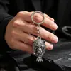 Nuevos colgantes de animales hip-hop de moda europeos y americanos, llaveros y accesorios para bolsos con cabeza de leopardo personalizados y elegantes