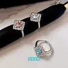 Anillo de diamante colorido hueco de encaje texturizado moda femenina borde versátil producto nuevo trébol de cuatro hojas abierto ajustable