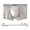 Ropa interior de malla de encaje sin costuras para hombre, calzoncillos tipo bóxer sexy ultradelgados de seda helada para verano con diseño hueco