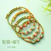 En stock envío rápido Festival del Bote del Dragón cadena colorida zongzi pulsera para bebé estilo infantil cadena de cinco colores cuerda tejida a mano cuerda de mano al por mayor