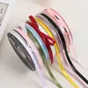 Lazo de regalo de color sólido de 1 cm flor decorativa para envolver material para ramos de cinta de satén venta al por mayor