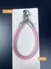 Nova pulseira de couro triangular com fivela dupla para celular, acessório universal, pulseira simples com fivela dupla, corrente de suspensão anti-queda