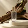 En stock botella de viaje transparente de 30 ml con rollerball roll-on botella de vidrio para aceites esenciales botella de vidrio redonda recta con rollerball botella para serum