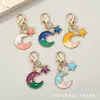 Llavero de luna creciente y estrella bicolor, colgante para mochila de estilo coreano con bloques de color de estrella y luna con cierre de mosquetón, pequeño regalo