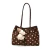 Bolso de mano casual de lunares con diseño de nicho, mochila elegante de moda de alta gama, bolso de hombro de gamuza chic vintage